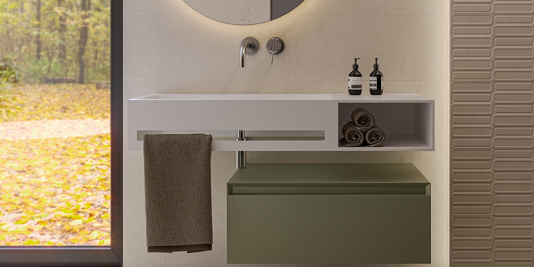 Lavabo flotante blanco con almacenamiento integrado y mueble inferior verde en baño moderno con luz natural.

