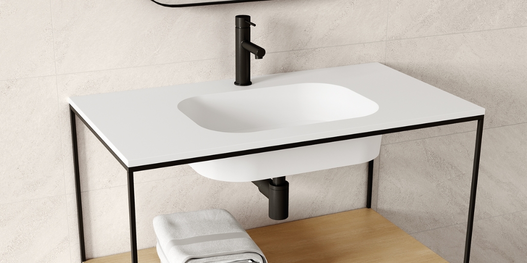 Lavabo redondo encastrado con encimera blanca, grifo negro mate y estructura metálica